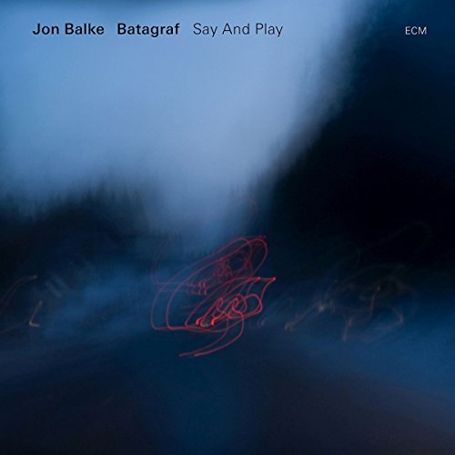 "Album cover with dark blue background, red abstract design, and artist names at the top."