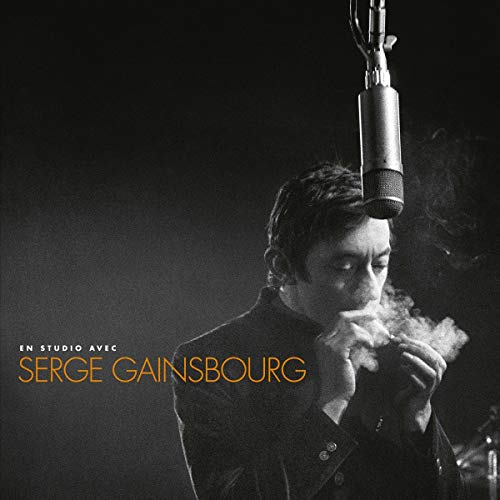 Black and white portrait of Serge Gainsbourg smoking with a microphone above.