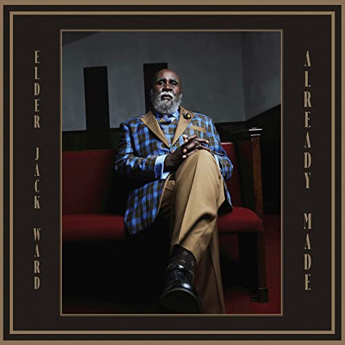 Vinyl album cover featuring a portrait of an older Black man in a suit.