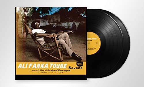 Vinyl record cover featuring a man lounging in a chair with a guitar.