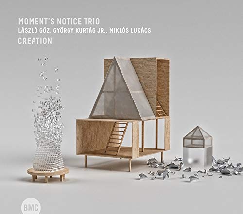 CD cover for Moment’s Notice Trio’s “Creation” featuring a wooden model house.