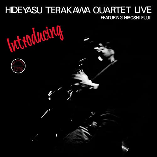 Black and white album cover featuring a blurred jazz musician playing saxophone.