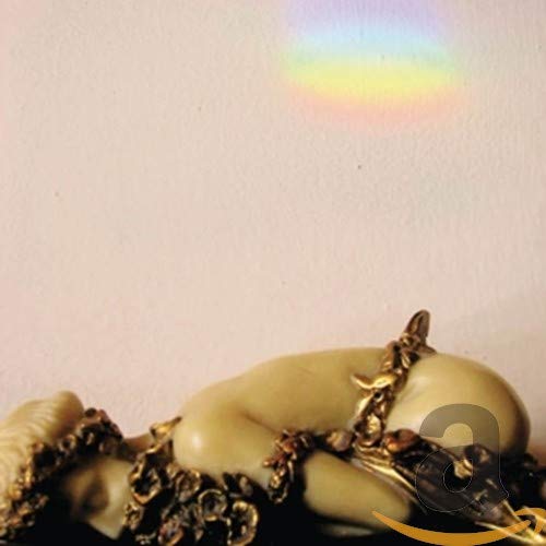 CD cover art featuring a reclining woman with golden details.