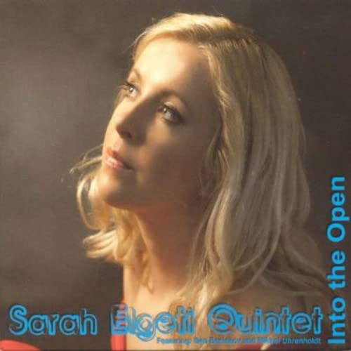 CD cover featuring a blonde woman looking upwards, titled "Into The Open".