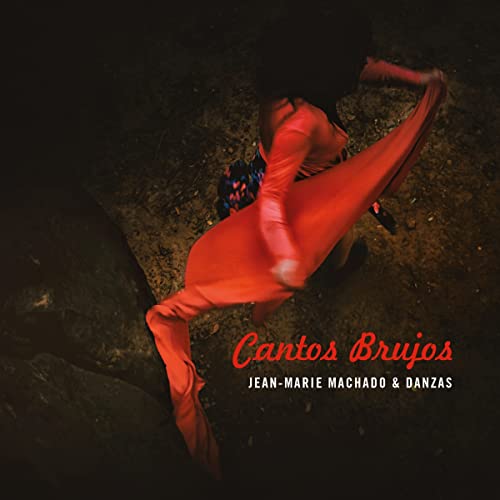 CD cover: dancer in red dress, blurred motion, dark background.