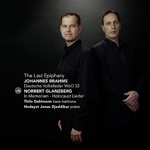 CD cover featuring two men in black shirts, with text details.