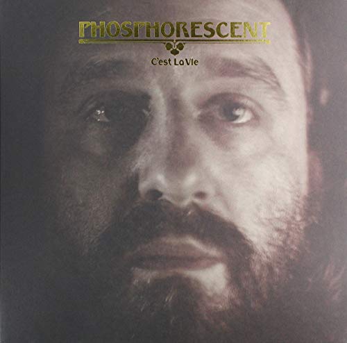 Album cover featuring a close-up portrait of a man with gold lettering.