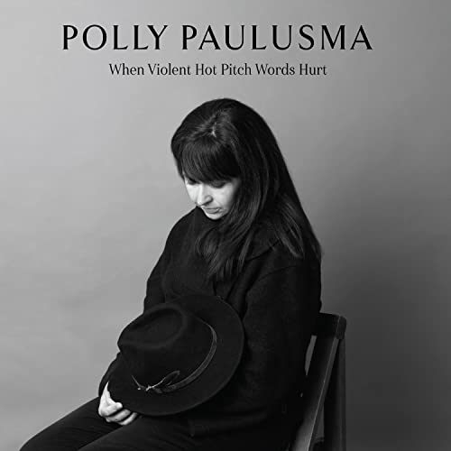 Black and white album cover featuring Polly Paulusma with a hat.