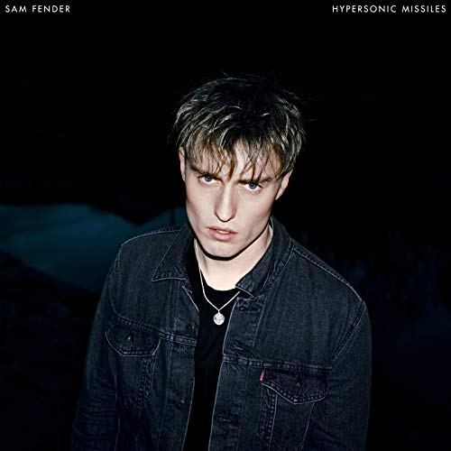 Album cover featuring a man in a denim jacket against a dark background.