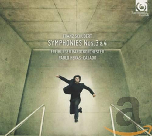 CD cover: man appearing to fall within a stark, grey corridor.