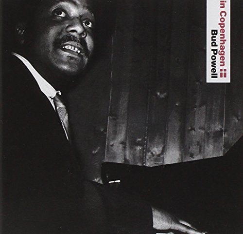 Black and white image of a man sitting at a piano with text overlay.
