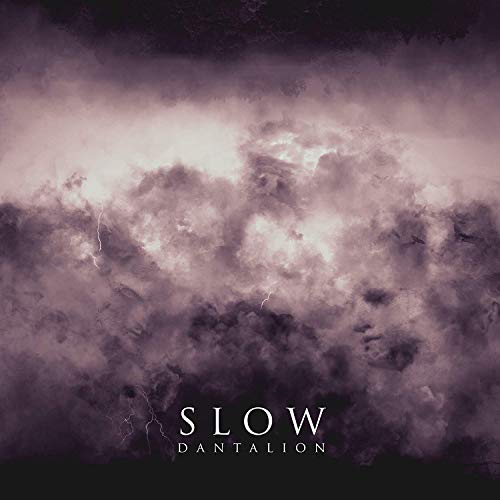 The image shows a cloudy sky with the text "SLOW DANTALION" at the bottom. For accessibility purposes, a concise alt text could be: "Dark, cloudy sky with 'SLOW DANTALION' text at the bottom."