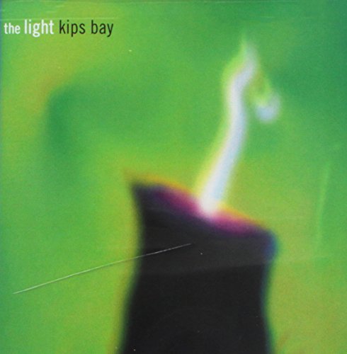 "Kips Bay album cover featuring a lit candle on a green background."