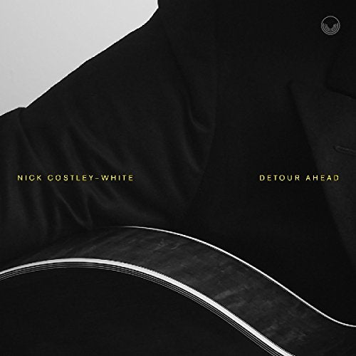 "CD cover with black shirt and guitar, featuring 'Nick Costley-White' and 'Detour Ahead' text."