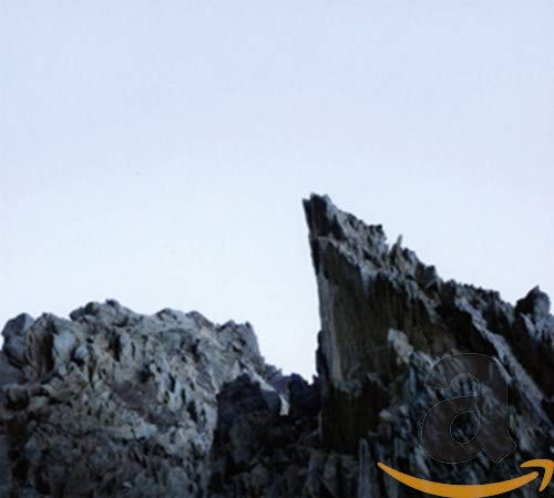 CD cover art depicting jagged, dark rocks against a pale sky.