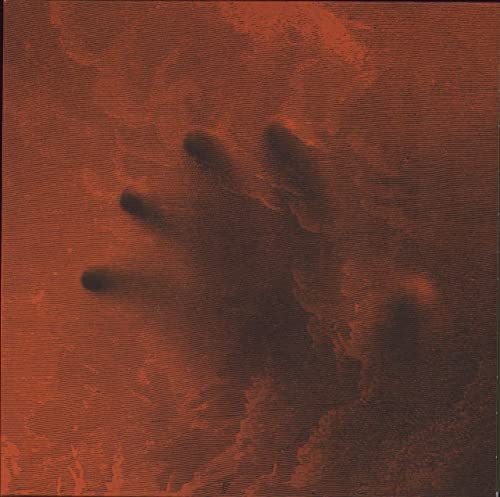 Red textured album cover with a shadowy handprint impression.