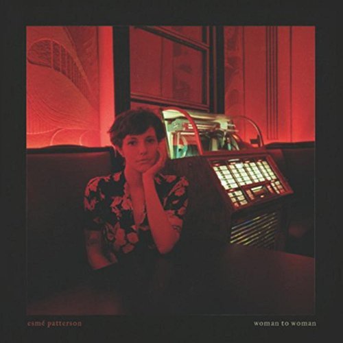 The alt text for the image is: "Album cover with a woman sitting by a jukebox in red lighting."
