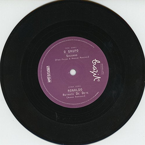 Black vinyl record with a purple label on a white background.