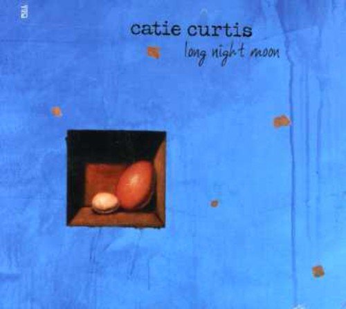 Catie Curtis album cover with blue background, eggs in a box, and orange spots.