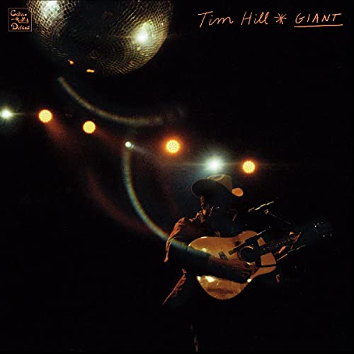 CD cover: Tim Hill playing guitar under a disco ball and lights.