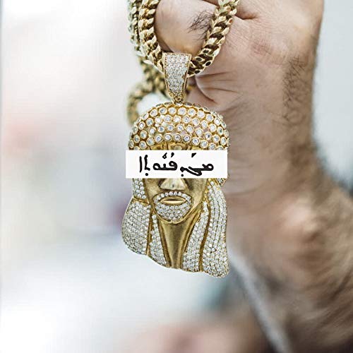 Gold pendant depicting a jeweled face with Arabic script.