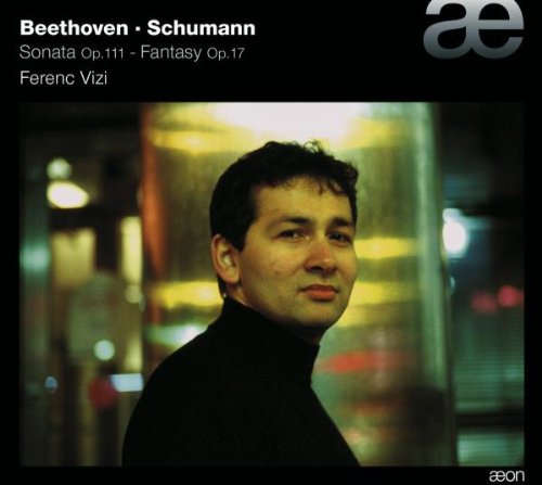 CD cover featuring a man in a black turtleneck, blurred background.