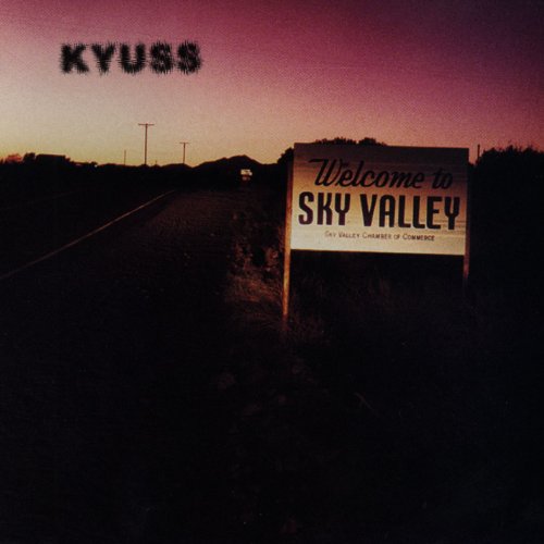 "Album cover with 'Welcome to Sky Valley' sign on a dark road at dusk."