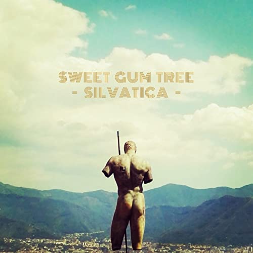 CD cover with a statue’s back against a mountainous, cloudy landscape.