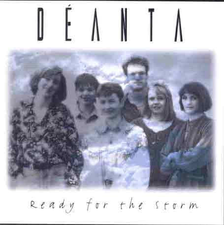 "Album cover with a black and white photo of six people against a cloudy sky."