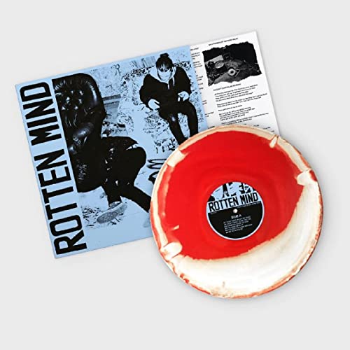 Red vinyl record and insert with black and white portrait photography.