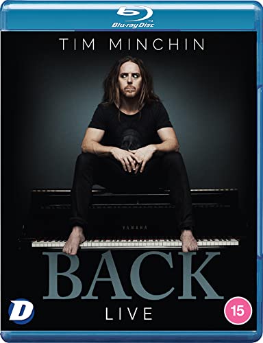 Tim Minchin sitting barefoot on a piano on a Blu-ray cover.