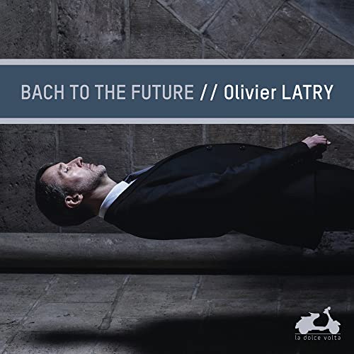 CD cover featuring organist Olivier Latry in a dark suit, reclining.