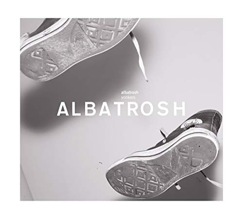CD cover with a grayscale image of two worn sneakers soles.