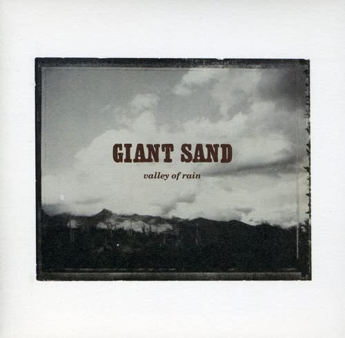 CD cover for Giant Sand’s “Valley of Rain” with a mountain landscape.