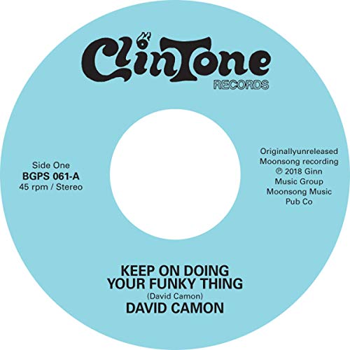 Turquoise 7-inch vinyl record label with black text and a center hole.