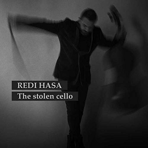 Black and white album cover featuring a man with arms outstretched.