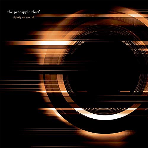 Album cover with abstract orange and white swirls on a black background.
