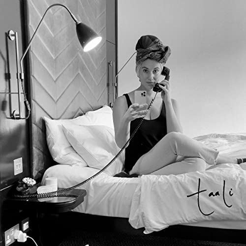 Black and white CD cover featuring a woman with a headwrap on a bed.
