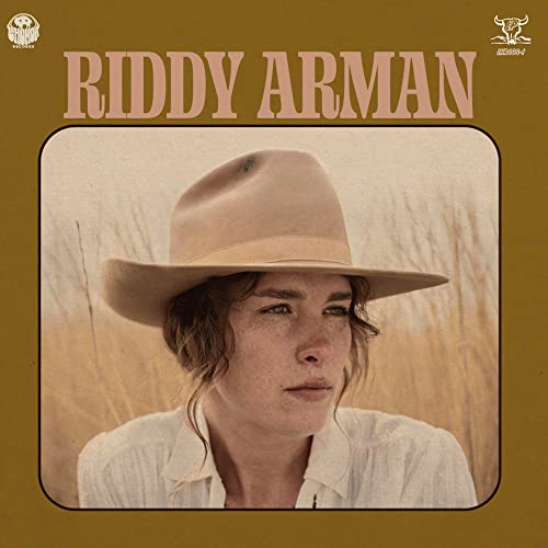CD cover: portrait of a person wearing a tan cowboy hat.