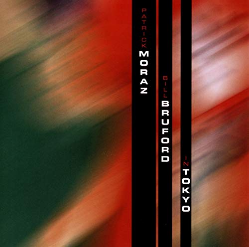 "Album cover with abstract red, green, and white background and black vertical text strip."