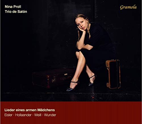 Woman in black dress sitting on suitcases, album cover art.