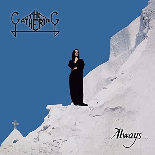 Album cover: woman in black on snowy cliff, blue sky.