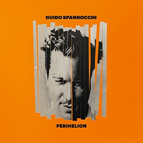 Orange album cover featuring a fragmented black and white portrait.
