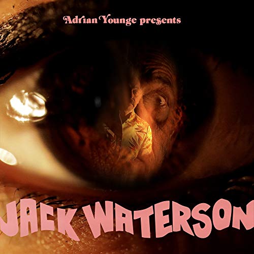 Album cover featuring an eye reflecting a person in a warm, hazy scene.