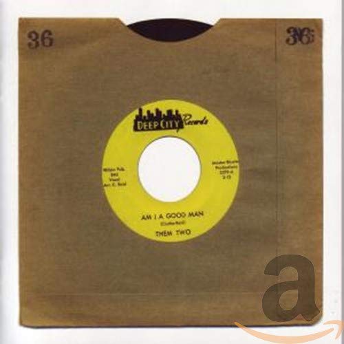 Yellow record label in a brown paper sleeve, text visible.