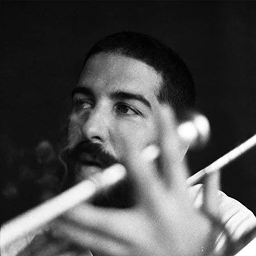 Black and white portrait of Antonio Neves with a flute.