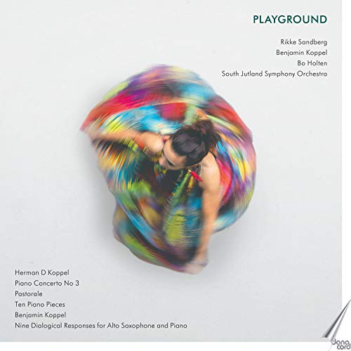 A CD cover featuring a dancing woman surrounded by colorful, swirling fabric on a white background.