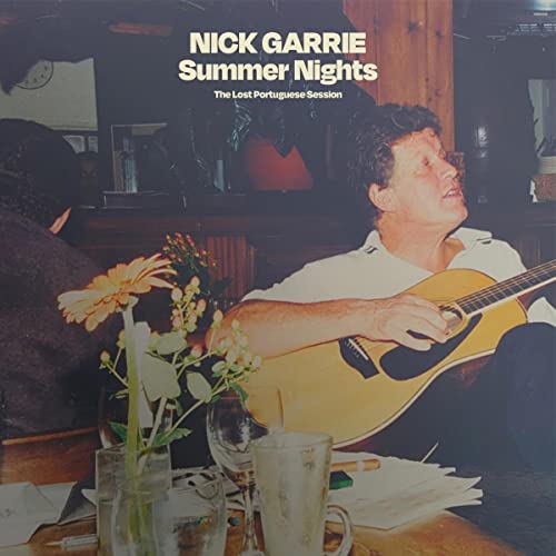 Vinyl album cover featuring a man with a guitar and flowers.