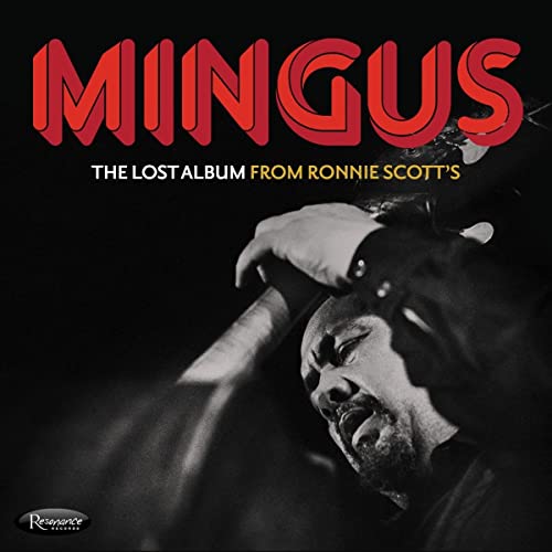 Charles Mingus album cover with a black and white photo of him playing bass.