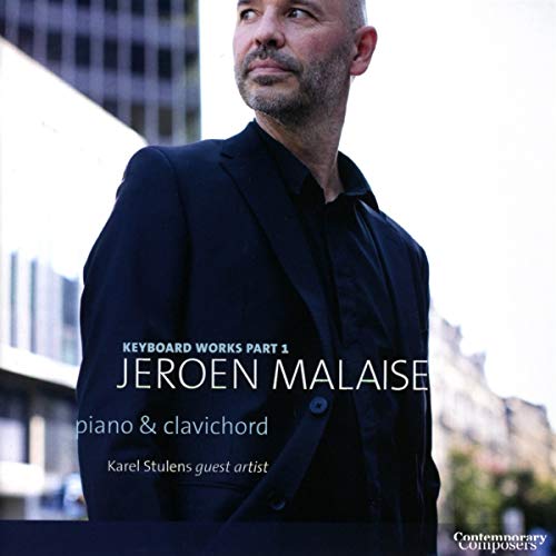 "Album cover featuring a man in a black suit against a blurred cityscape background."